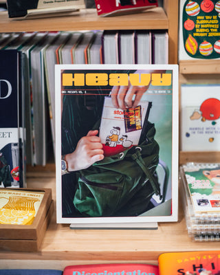 Volume 0 of HEAVY our print newsletter hangs out amidst our book table