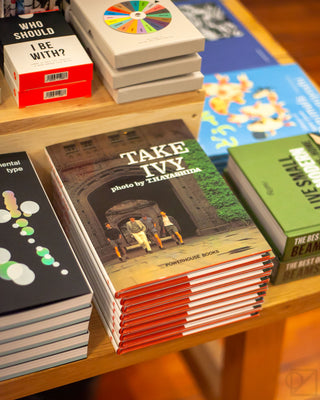 A view of our book table featuring a hardcover photo book called Take Ivy