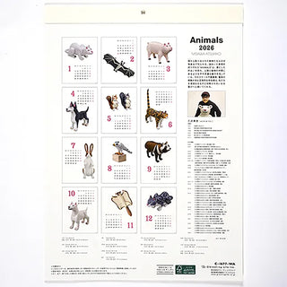 Calendar with animal figurines on a white background