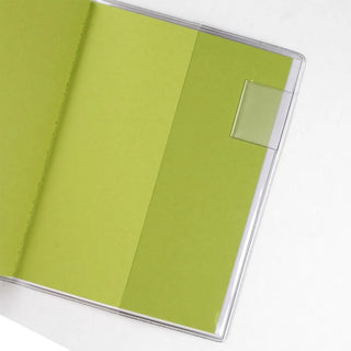 A6 monthly planner inside cover with lime green sheet under clear plastic cover
