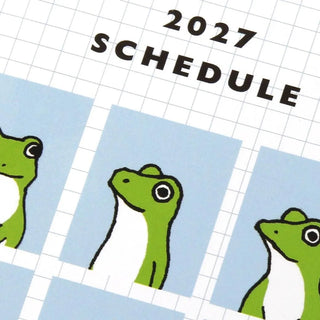 Close-up of 2027 schedule A6 monthly planner cover with frog illustrations