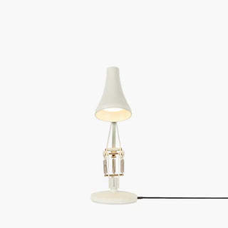 Small table lamp with a white shade on a white background