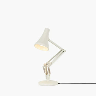 White desk lamp with adjustable arm on a white background