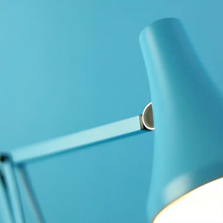 Blue lamp with a light on a blue background