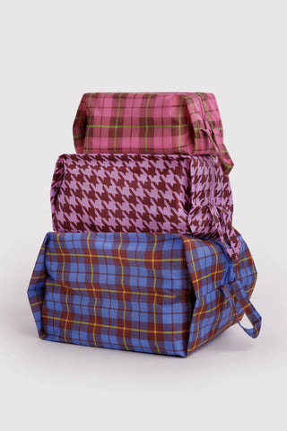 3d zip set of packing pouches in colorful tartan and houndstooth patterns