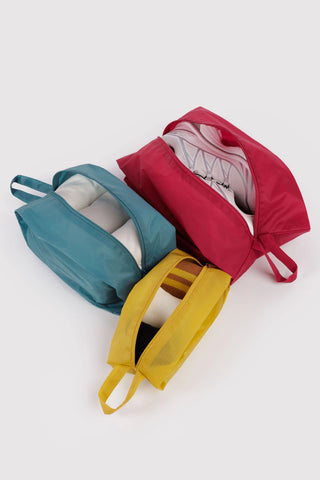 3d zip set of packing pouches in red, green, and yellow with clothing items inside