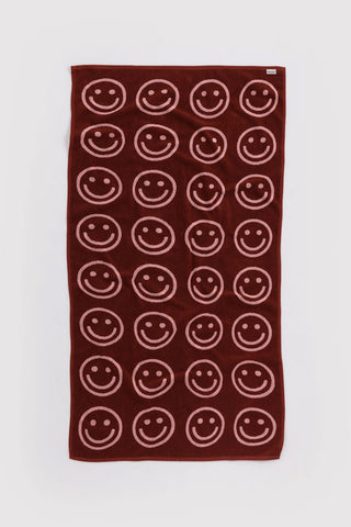 baggu bath towel with red and pink smiley face pattern