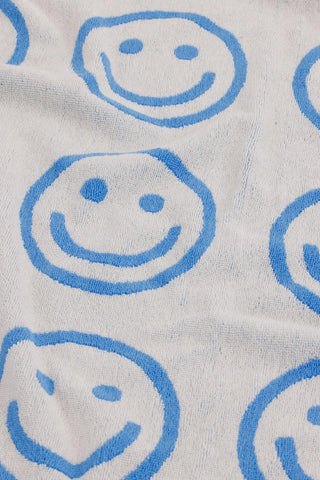 close up of baggu towel with smiley face pattern