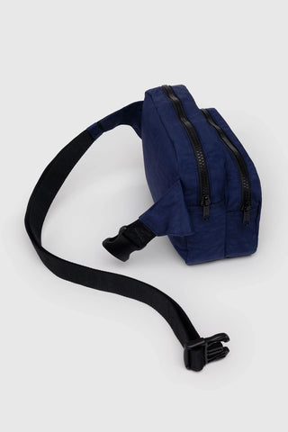 Navy blue waist bag with a black strap on a white background