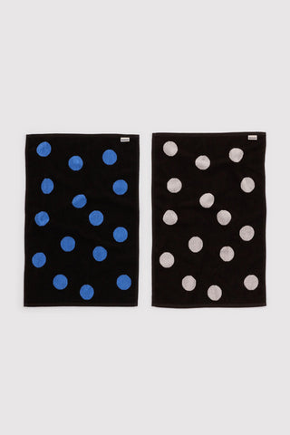 Set of baggu hand towels with polka dot pattern, featuring black and blue colorway and black and white colorway