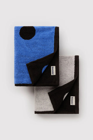 folded set of baggu hand towels with polka dot pattern, featuring black and blue colorway and black and white colorway