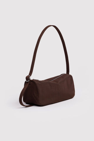 Brown shoulder bag on a light gray background