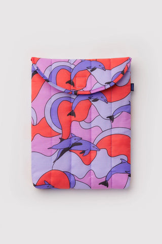 Colorful laptop sleeve with dolphin pattern on a light gray background