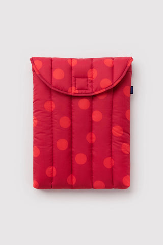 baggu laptop sleeve with red polka dots on a light background