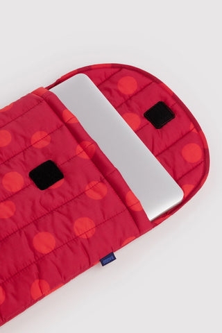 Baggu laptop sleeve with red polka dot pattern opened with device inside on a light background