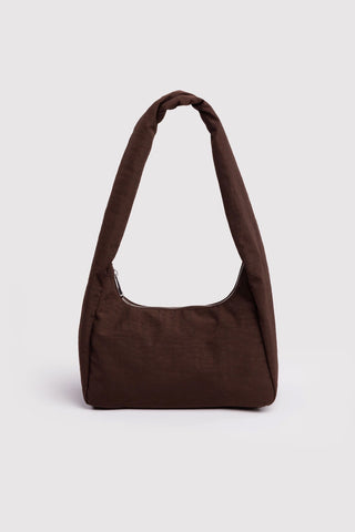 Brown shoulder bag on a light gray background