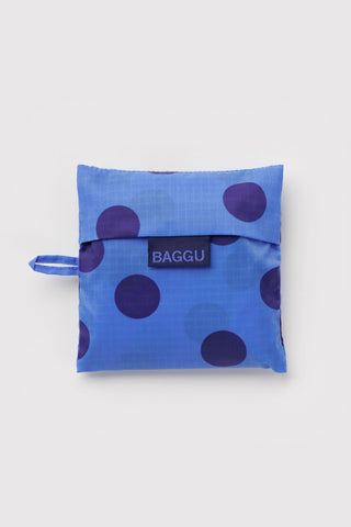 folded blue polka dot baggu tote on a light background