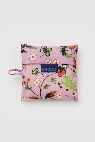 folded pink baggu tote bag with flowers and animals print on a light background