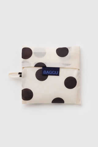 folded black and cream polka dot baggu tote on a light background
