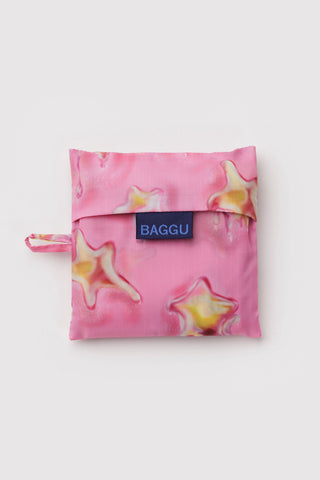 Pink reusable bag with star design and 'BAGGU' logo on a white background