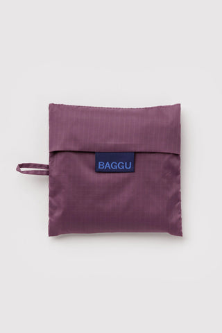 folded plum colored baggu tote on a light background