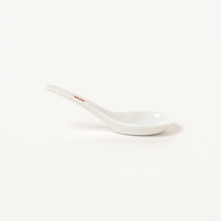 White ceramic spoon on a white background