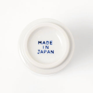 Bottom of ceramic cup with 'MADE IN JAPAN' text in blue on a white background