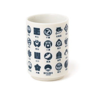 White mug with black geometric designs and 'Beams Japan' branding on a white background