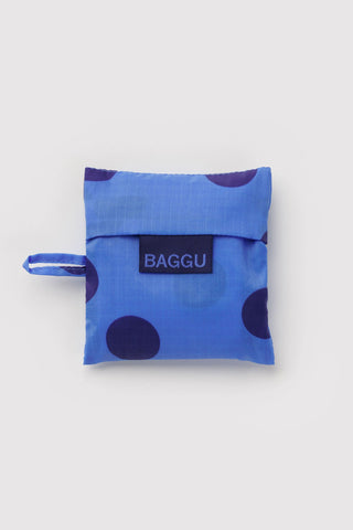 folded baggu bag with blue polka dot print on a light background