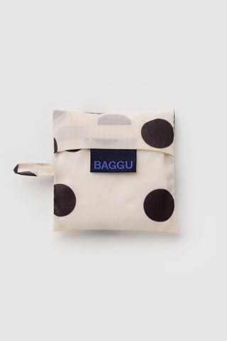 folded baggu bag with white and black polka dot print on a light background