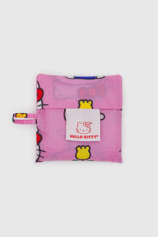 Pink Hello Kitty pouch with a white tag on a light gray background