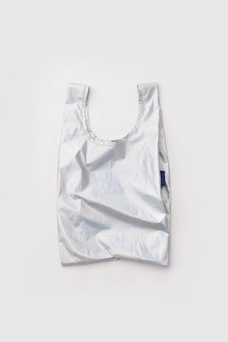 Silver reflective reusable bag on a light gray background