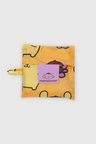 Yellow pouch with cartoon design and pink label on a white background