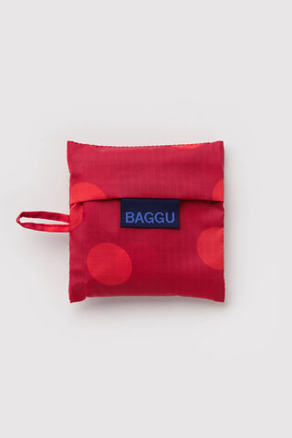 folded baggu with red polka dot print on a light background