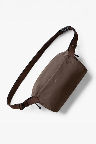 Bellroy sling in a brown color on a white background