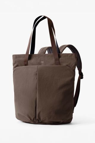 Brown tote bag with shoulder strap on a white background
