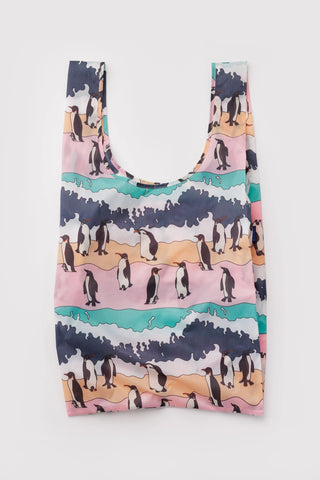 Reusable shopping bag with penguin pattern on a white background
