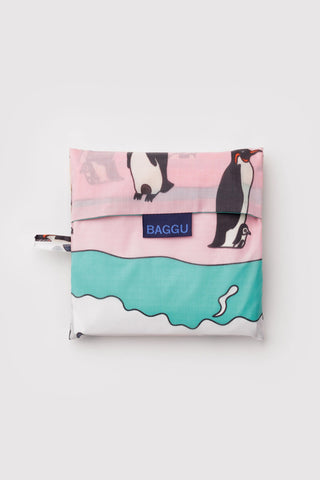 Foldable shopping bag with penguin design and 'Baggu' branding on a white background