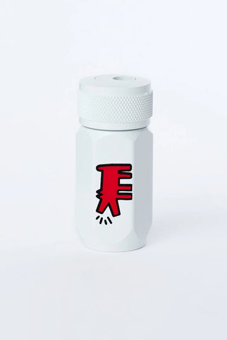 White pencil sharpener with a red and black dog on a white background