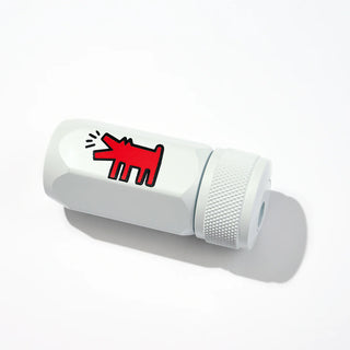 White pencil sharpener with red cartoon dog design on a white background