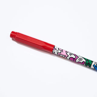 Red pencil guard on a colorful pencil on a white background