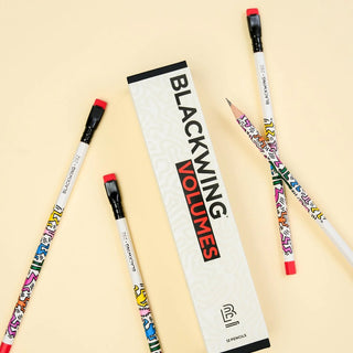 Blackwing Volumes pencils with colorful designs on a beige background