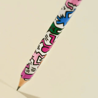 Colorful pencil with abstract design on a beige background