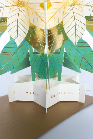 3D leaf-shaped Christmas card with gold and green leaves on a white background
