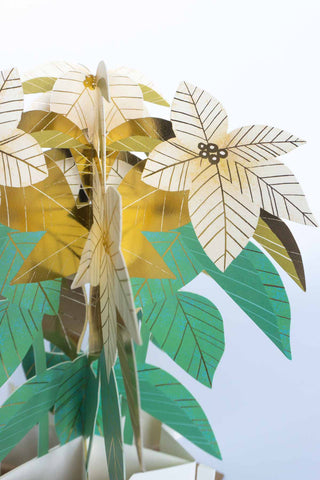 3D paper plant with gold and green leaves on a white background