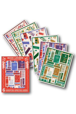 Set of assorted greeting cards with book-themed designs on a white background