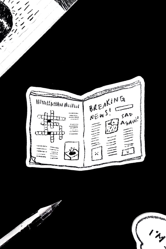 Sticker illustration of a newspaper with a crossword puzzle and text on a black background