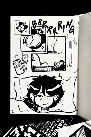 Illustrated comic strip with a character under a blanket, various objects, and text on a black background.