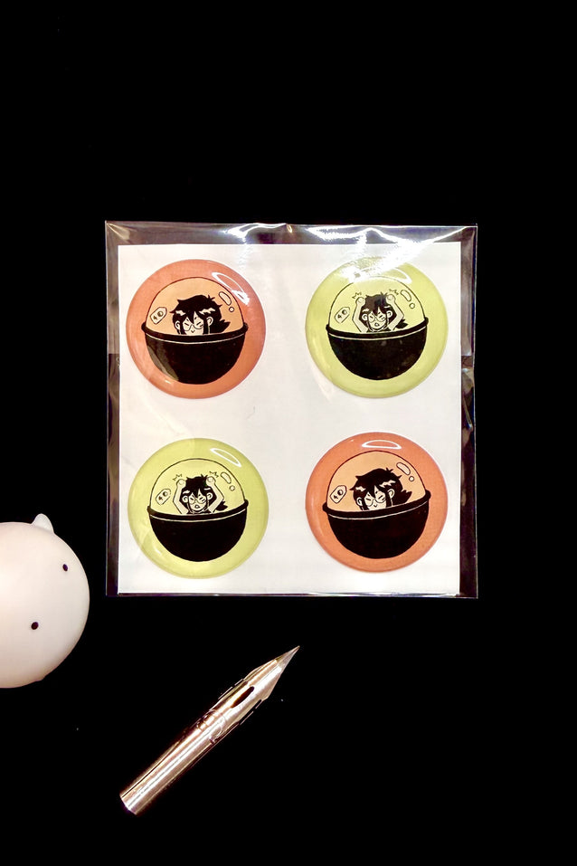Bubble sticker sheet with four circular character stickers in orange and lime