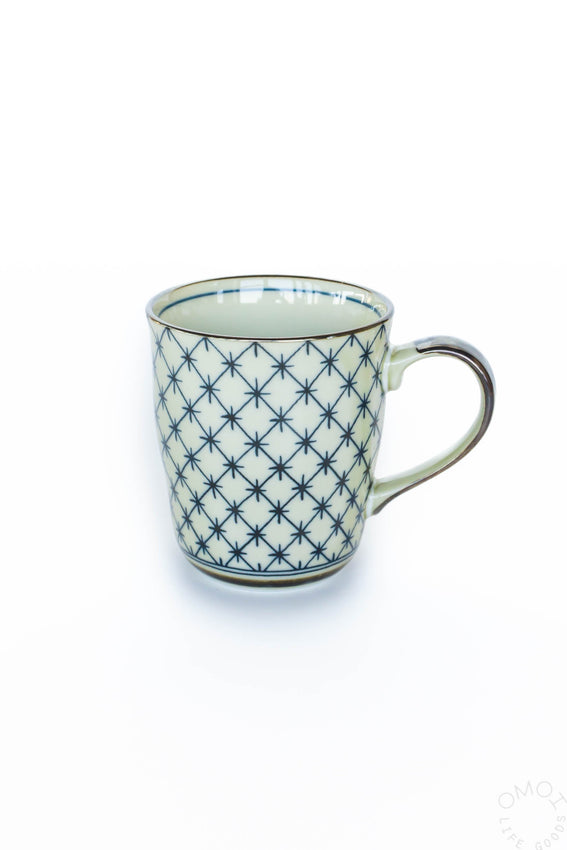 Celadon lattice 8 oz ceramic mug, cream with dark blue star lattice pattern